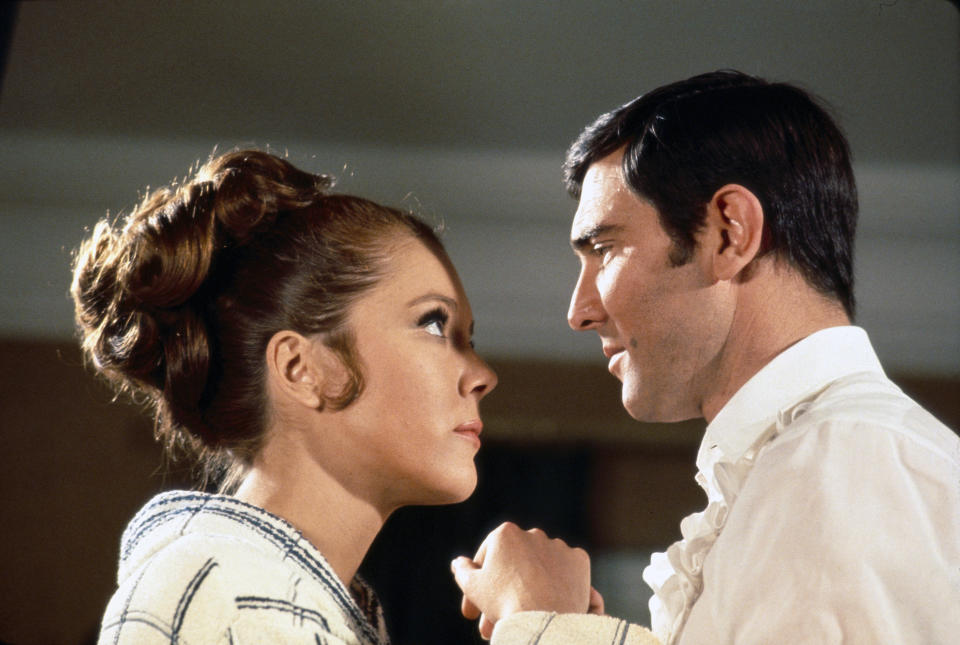 British actress Diana Rigg and Australian actor George Lazenby on the set of On Her Majesty's Secret Service, directed by Peter R. Hunt. (Photo by Sunset Boulevard/Corbis via Getty Images)