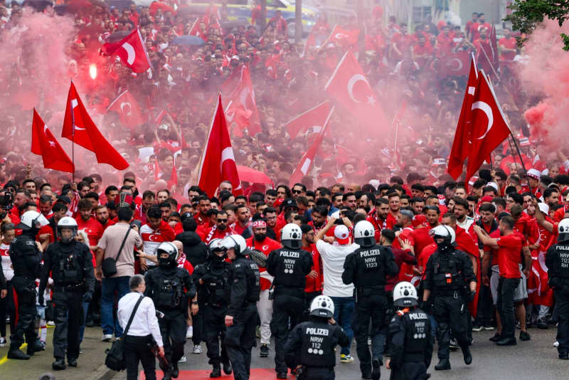 Thousands of Turkish fans march from Dortmund city center to the stadium, ahead of the UEFA EURO 2024 Group F soccer match between Turkey and Georgia. Christoph Reichwein/dpa