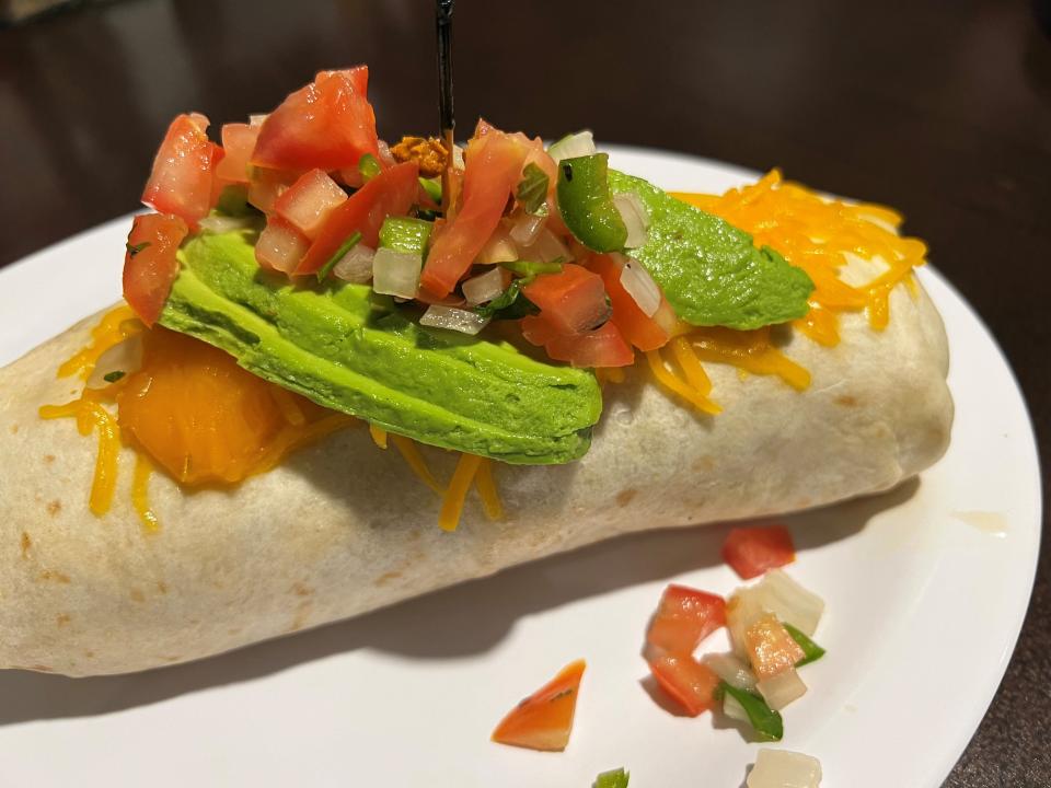 The mega burrito at Egg Bistro, the new breakfast and lunch restaurant in Ankeny, comes loaded with chorizo, onions, scrambled eggs, house potatoes, beans and jalapenos inside a flour tortilla with avocado and pico de gallo on top.