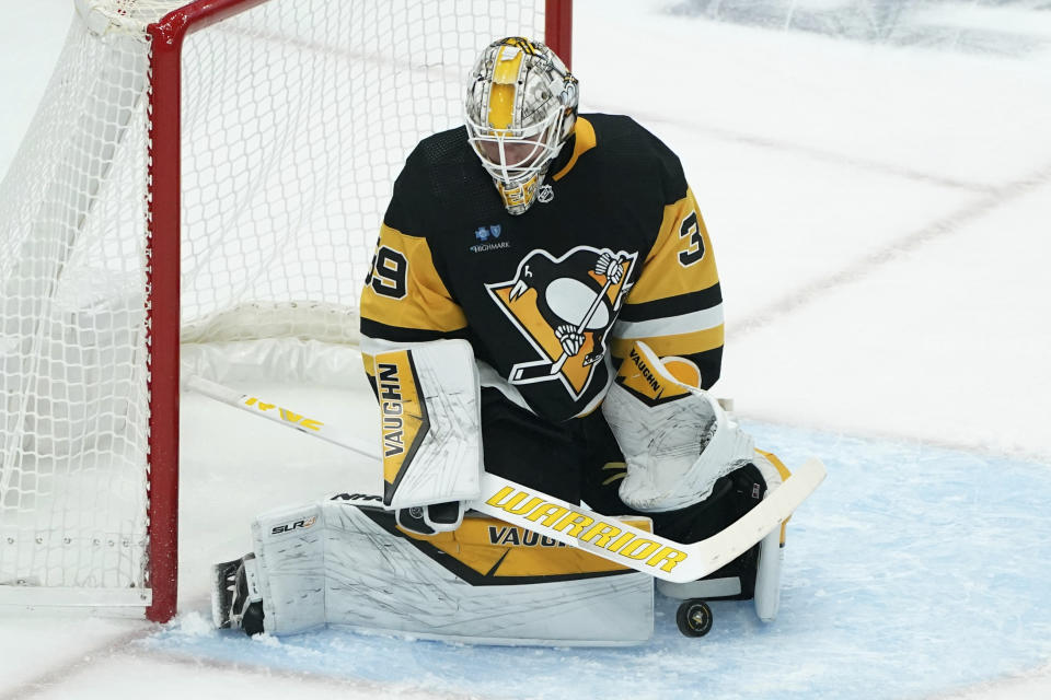 Pittsburgh goaltender Alex Nedeljkovic makes a save against the Vegas Golden Knights during the first period of an NHL hockey game, Sunday, Nov. 19, 2023, in Pittsburgh. (AP Photo/Matt Freed)