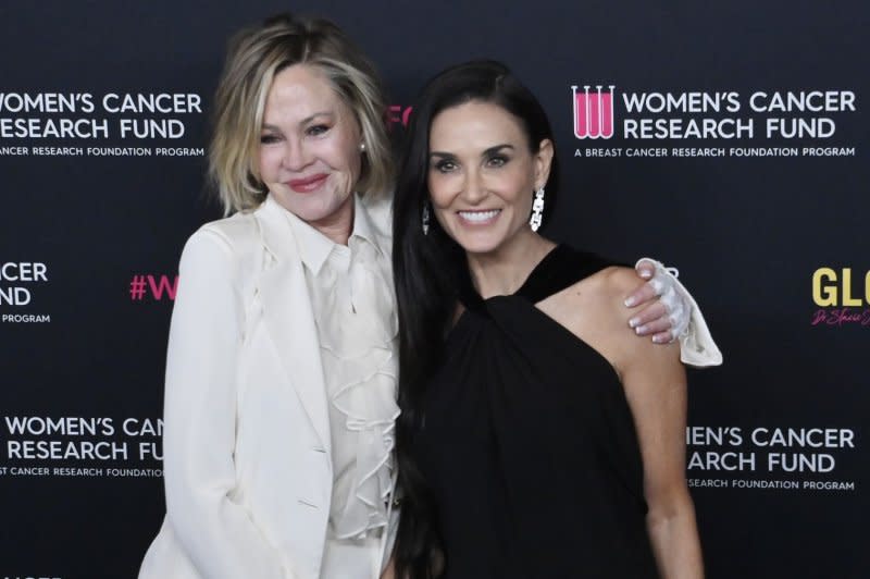Melanie Griffith (L) and Demi Moore attend the "An Unforgettable Evening" gala benefiting the Women's Cancer Research Fund on Wednesday. Photo by Jim Ruymen/UPI