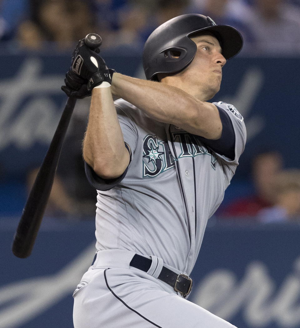 Seattle Mariners' Kyle Seager watches his solo home run against the Toronto Blue Jays during the eighth inning of a baseball game in Toronto on Saturday, Aug. 17, 2019. (Fred Thornhill/The Canadian Press via AP)