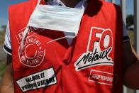 Protester wears a waistcoat with Force Ouvriere (FO) Metaux signage during a demonstration outside the Airbus factory in Blagnac