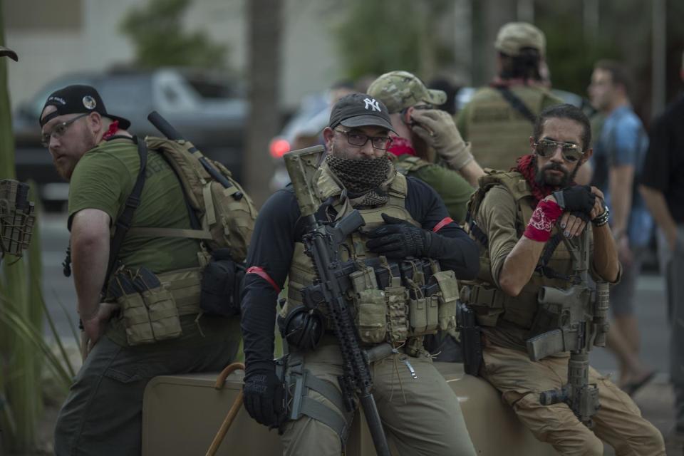 PHOENIX, AZ - AUGUST 22: Members of the John Brown Gun Club, who oppose President Trump, carries weapons as a "community defense team" in case of an attack on protesters outside the Phoenix Convention Center before a rally by President Donald Trump on August 22, 2017 in Phoenix, Arizona. An earlier statement by the president that he was considering a pardon for Joe Arpaio,, the former sheriff of Maricopa County who was convicted of criminal contempt of court for defying a court order in a case involving racial profiling, has angered Latinos and immigrant rights advocates. (Photo by David McNew/Getty Images)