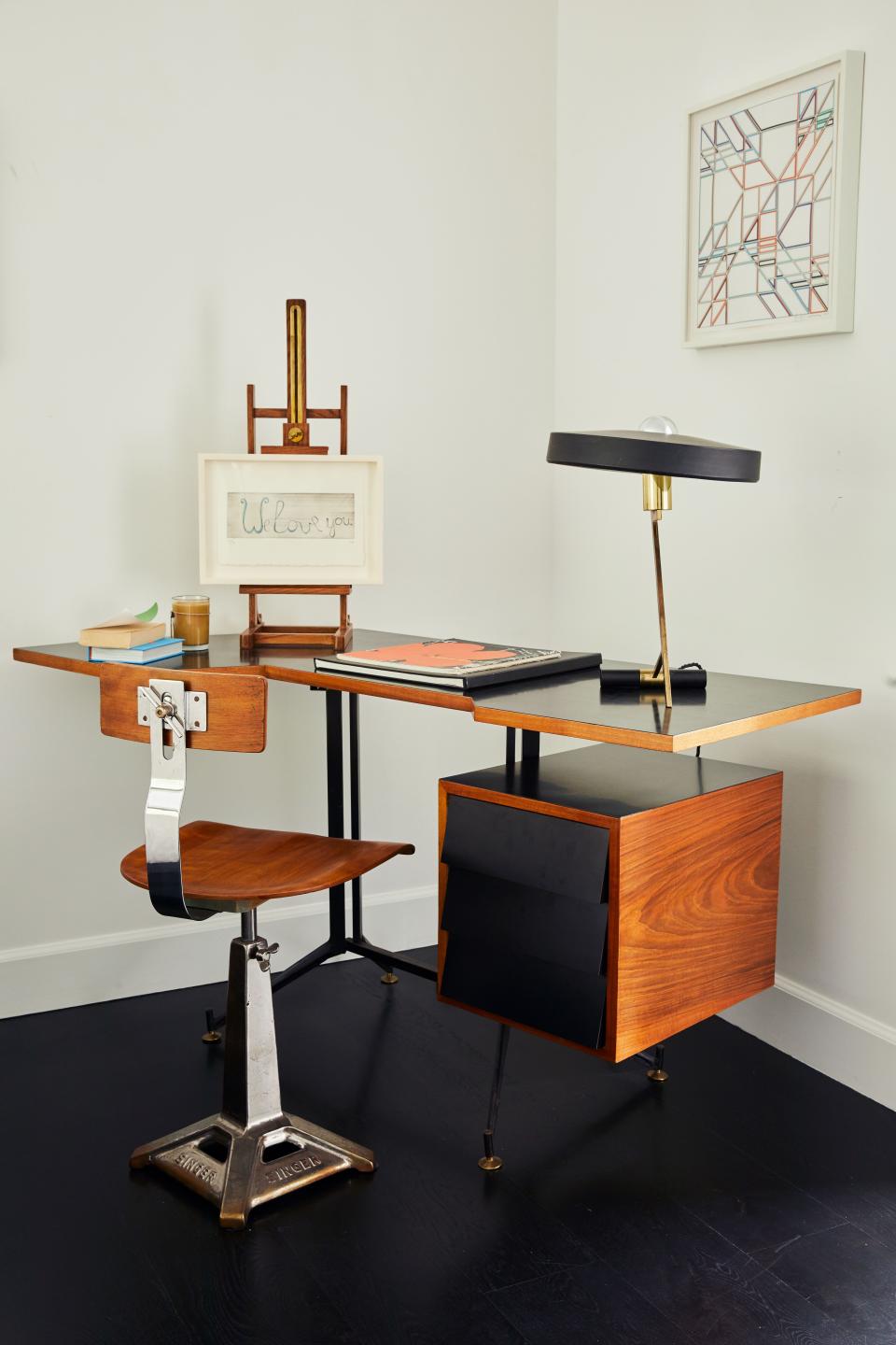 For a change, there are no Brazilian furnishings in this corner of the guest bedroom. The desk is a 1950s piece thought to be an original Gio Ponti (although the couple has not been able to confirm this) paired with a 1940s Singer sewing chair. On the easel is a Louise Bourgeois sketching titled We Love You.