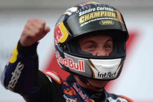 KTM rider Sandro Cortese of Germany celebrates after winning the inaugural Moto3 world champion, following victory at the Malaysian Motorcycle Grand Prix at Sepang. Cortese started from the front row and raced to the chequered flag in 40 minutes 54.123 seconds over the 18-lap race