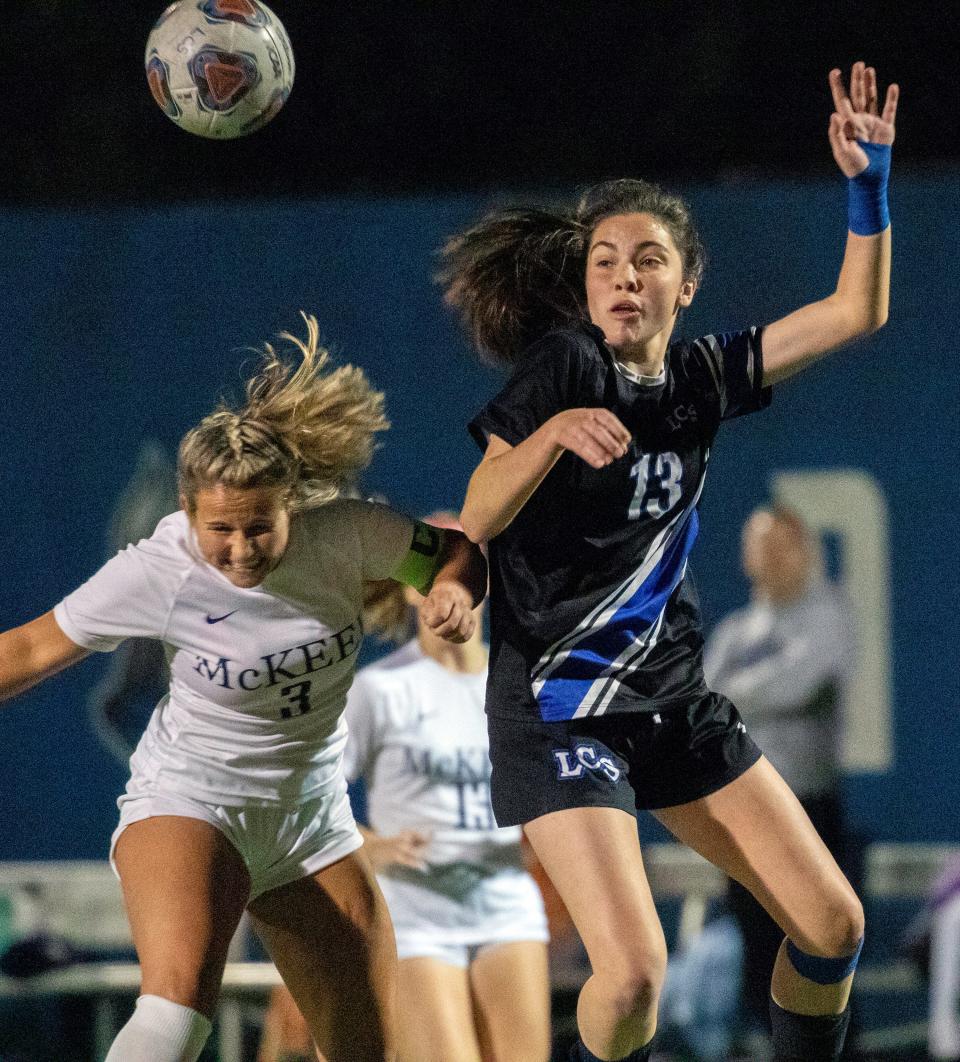 Lakeland Christian's Kaelyn Diaz and McKeel's Ashlyn Herzog go up for a header during their Champions bracket semifinal match. Diaz scored the first goal in the Vikings' 2-0 victory.