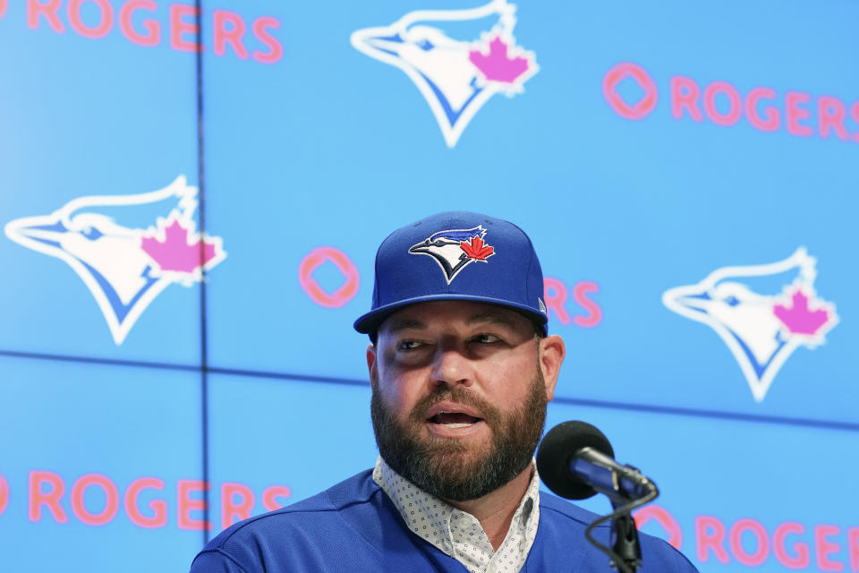 Toronto Blue Jays manager John Schneider speaks during a press conference in Toronto on Friday, Oct. 21, 2022. The Toronto Blue Jays and manager John Schneider have agreed to terms on a three-year contract with a team option for the 2026 season, the club announced Friday. (Nathan Denette/The Canadian Press via AP)