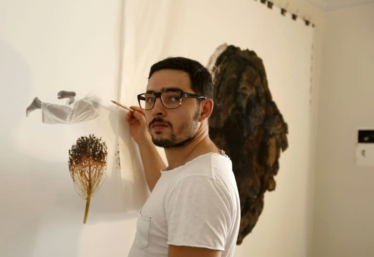 Iranian artist Nima Zaare-Nahandi, seen during an interview with AFP at his house in Tehran