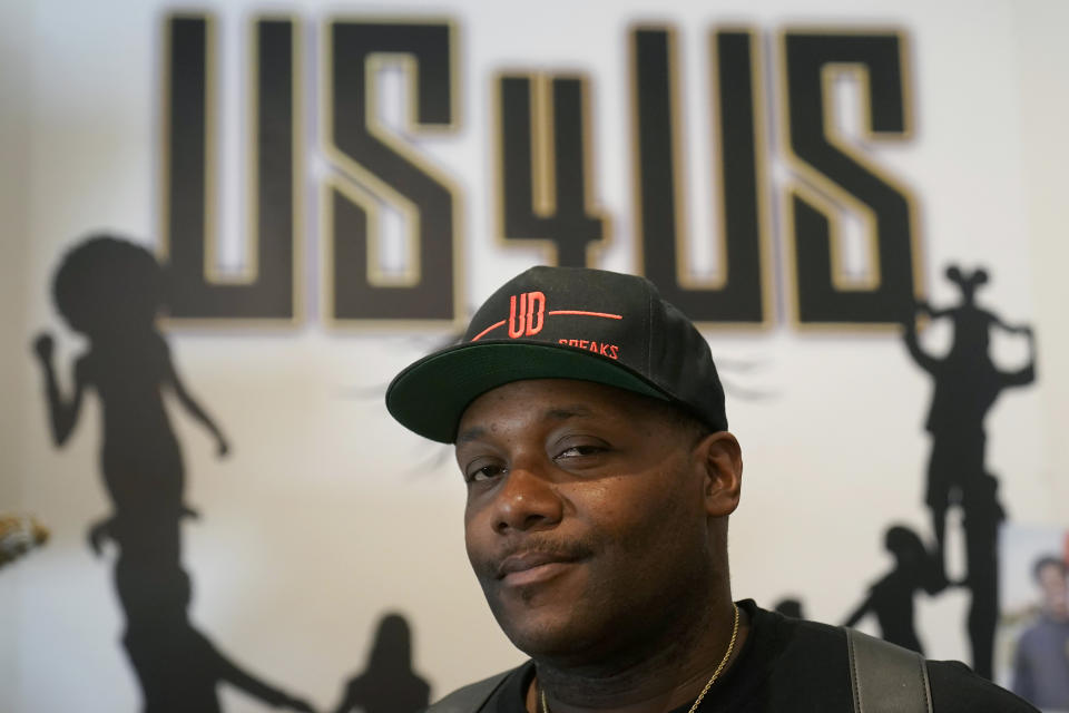 Damien Posey is photographed in the Us 4 Us office in San Francisco, Friday, May 12, 2023. Posey, 44, grew up in historically Black neighborhoods in San Francisco, where he heard gunshots at night and was bussed to schools in neighborhoods that weren't so welcoming to Black children. He spent a decade in prison on a weapons charge and later started the nonprofit called Us 4 Us Bay Area to mentor youth and reduce gun violence. (AP Photo/Jeff Chiu)