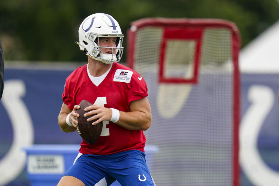 Indianapolis Colts quarterback Sam Ehlinger throws during practice at the NFL team's football training camp in Westfield, Ind., Saturday, July 31, 2021. (AP Photo/Michael Conroy)