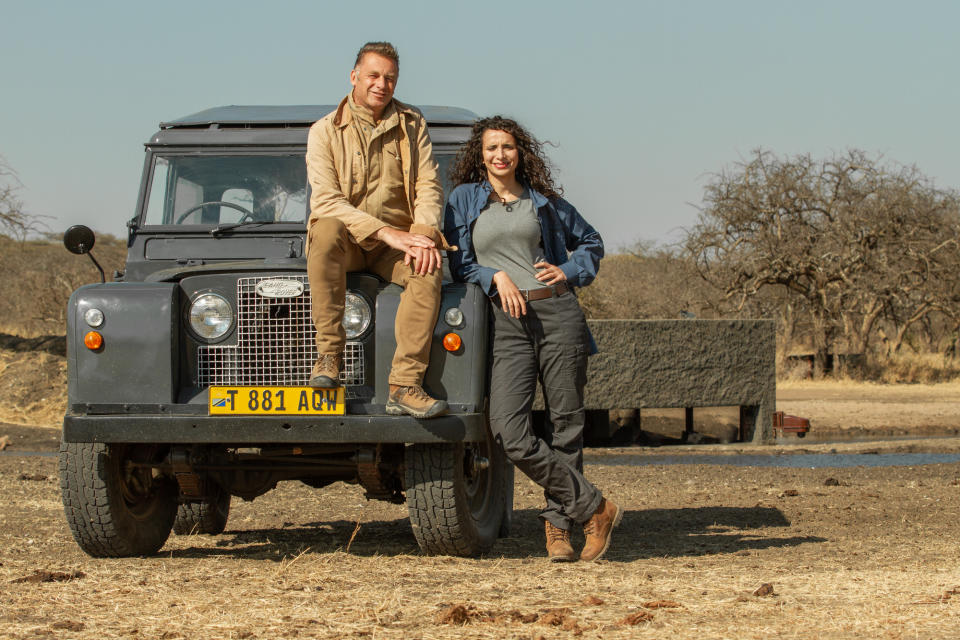 Chris Packham and Ella Al-Shamahi at the Waterhole in BBC documentary Waterhole: Africa’s Animal Oasis (Clare Jones/BBC)