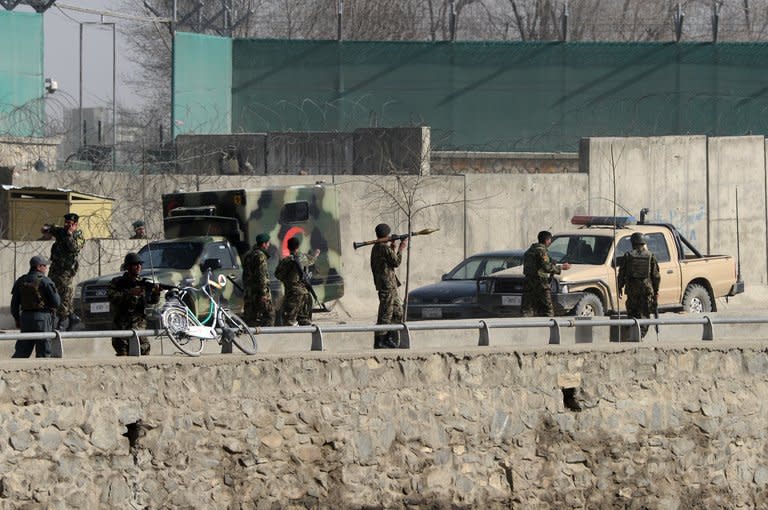 Afghan National Army soldiers and security personnel pictured at the site of a suicide attack, next to the ministry of defence in Kabul, on March 9, 2013. The blast came during a visit to the Afghan capital by new US Defense Secretary Chuck Hagel