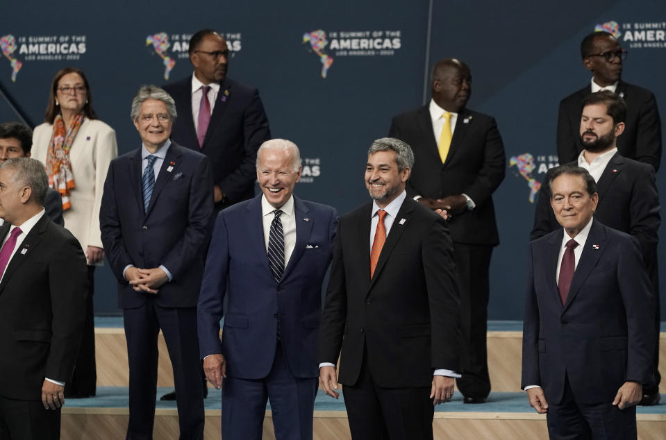 President Joe Biden puts his arm around Paraguay President Mario Abdo Benitez as they participate in a family photo with heads of delegations at the Summit of the Americas, Friday, June 10, 2022, in Los Angeles. (AP Photo/Jae C. Hong)