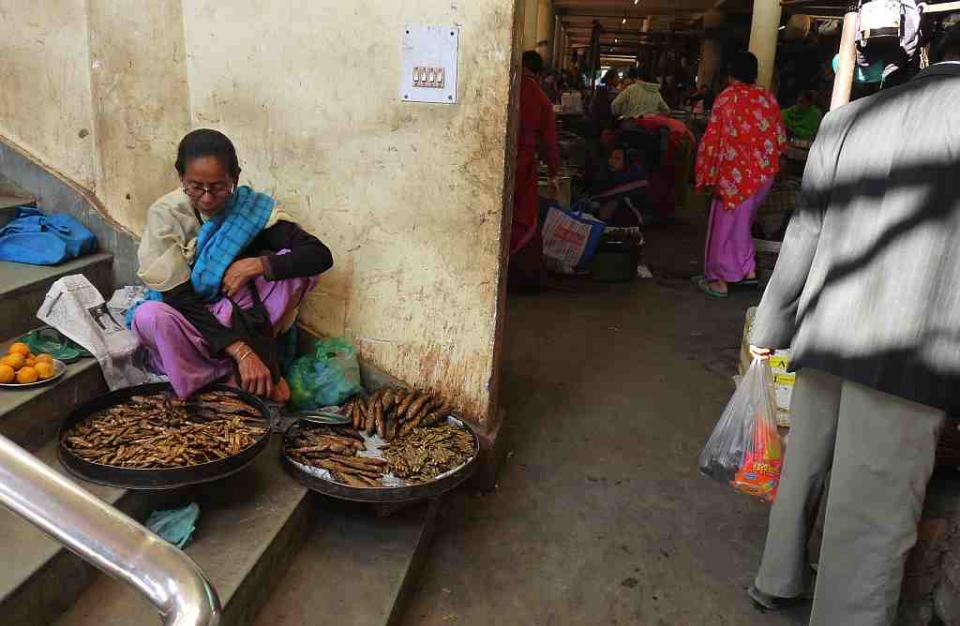 For those who can't be accommodated inside the market, like this fish-seller, places are reserved outside.