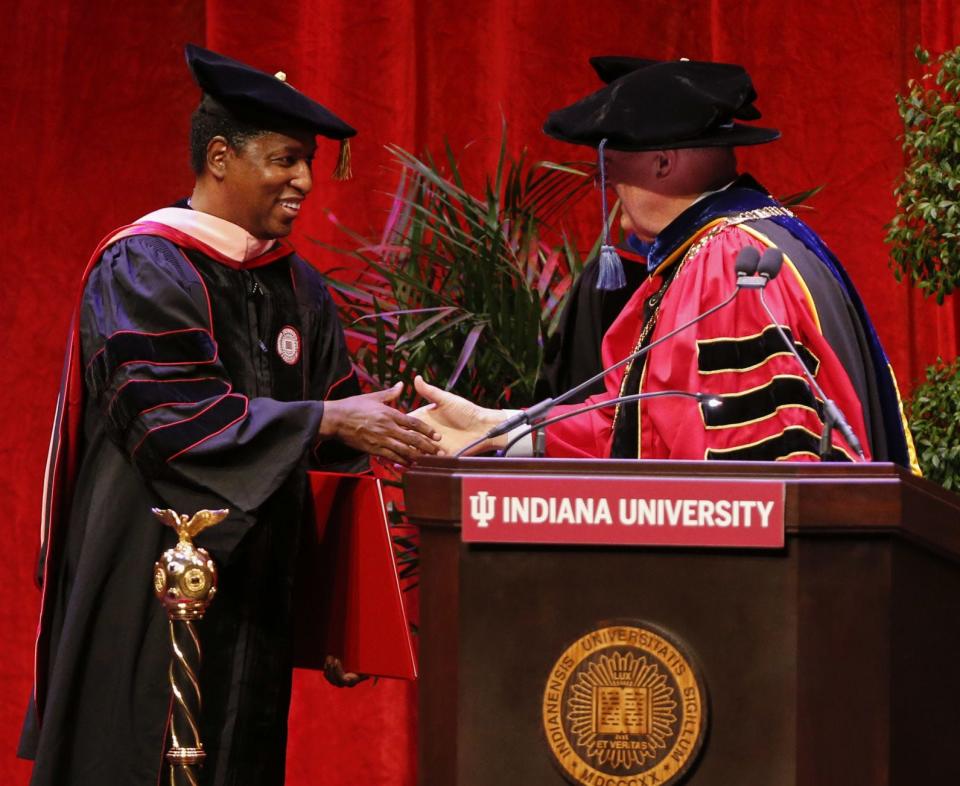 Artist, producer, songwriter and musician Kenneth “Babyface” Edmonds, left, shakes hands Thursday with IU President Michael McRobbie after receiving an honorary degree from Indiana University.