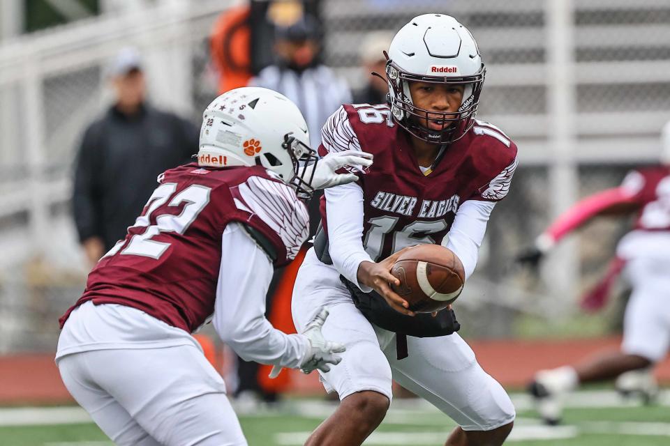 Hodgson Silver Eagles quarterback Xavier Brown (16) hands off the ball to Running Back Maki Beach (22) during a regular season game between Hodgson and Middletown Saturday, Oct. 14, 2023, at Bob Peoples Stadium on the campus of Caravel Academy in Bear, DE.