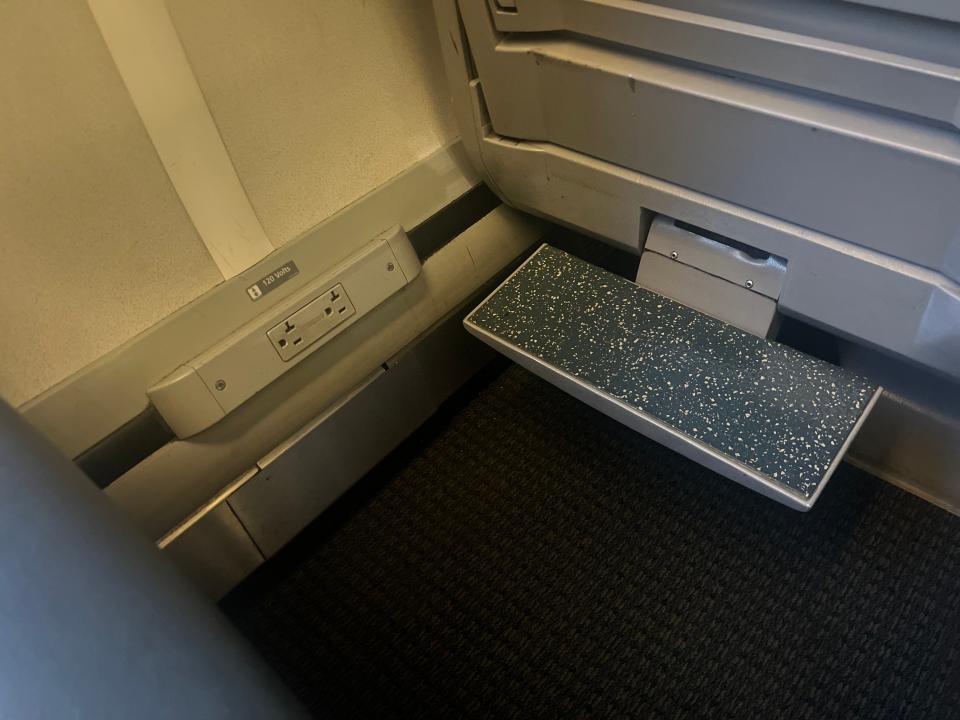 The power outlets and footrest on Acela.