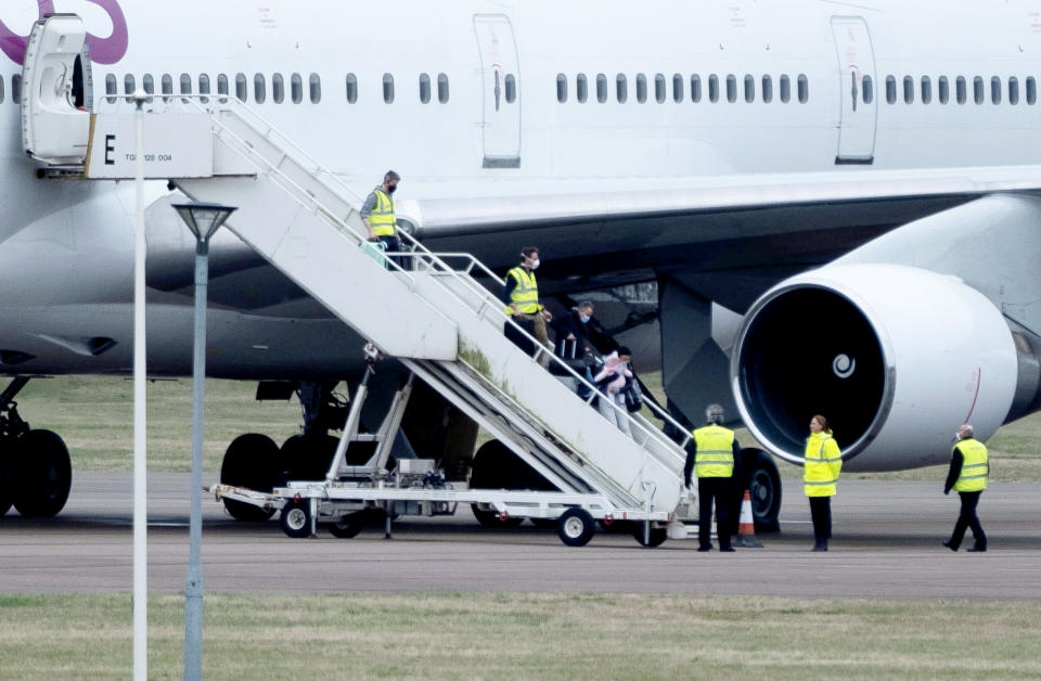 British people arrive back in the UK after being evacuated from Wuhan. (SWNS)