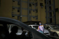 Ada Mendoza, 24, arrives home with her newborn daughter Peyton after being discharged from the hospital, in the Catia neighborhood of Caracas, Venezuela, Saturday, Sept. 12, 2020. The first-time mother is full of renewed courage and trust that she’ll continue dodging the onslaught of obstacles brought by the pandemic and her nation’s crisis, for the sake of her little girl. (AP Photo/Matias Delacroix)