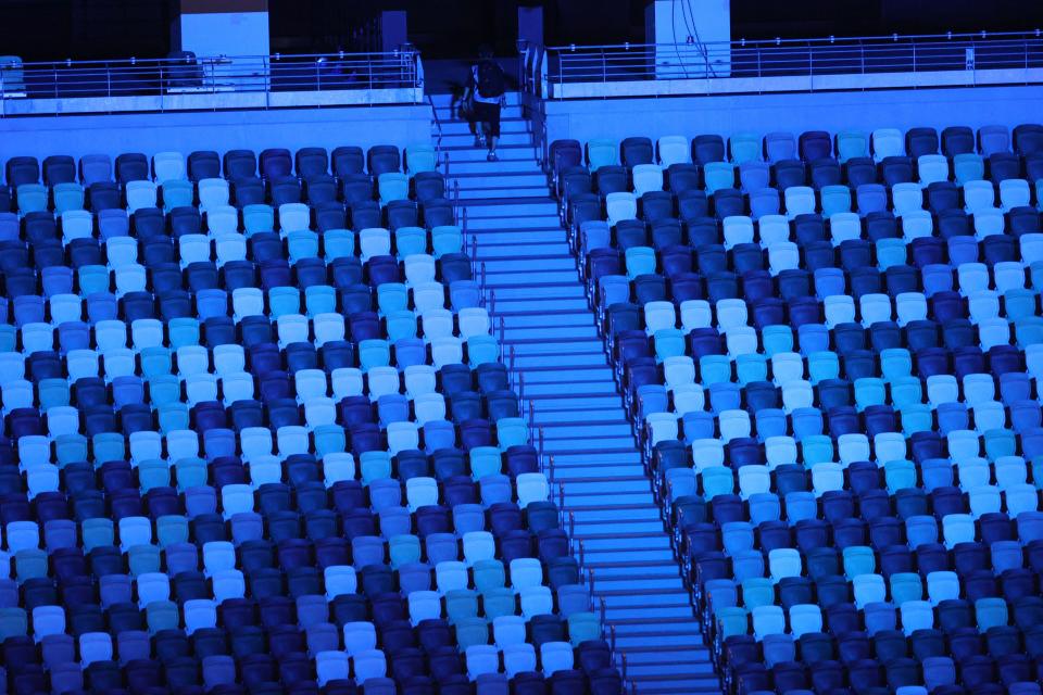 <p>A view shows empty seats in the stadium during the opening ceremony of the Tokyo 2020 Olympic Games, at the Olympic Stadium in Tokyo, on July 23, 2021. (Photo by Leon Neal / POOL / AFP) (Photo by LEON NEAL/POOL/AFP via Getty Images)</p> 