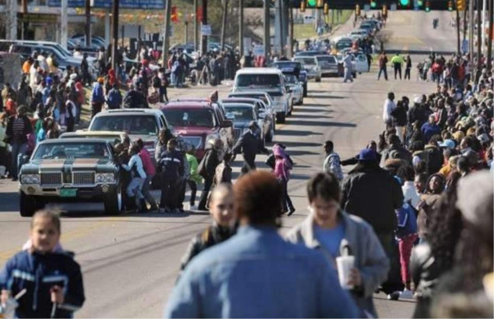 A crowd lines Fairview Avenue in Montgomery for the annual Lacey-Boyd New Year's Day Parade in Montgomery.