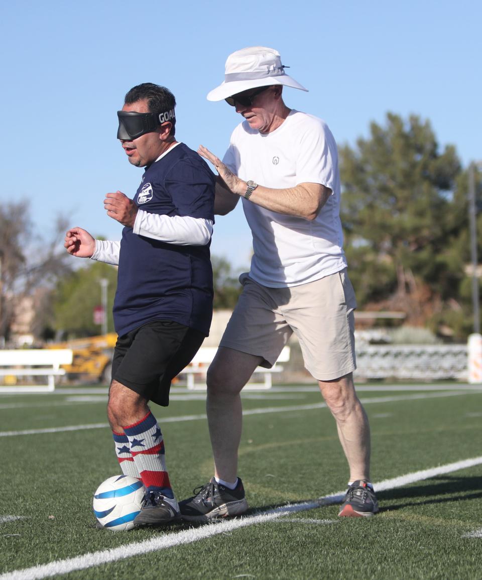 Blind soccer player Alvaro Mora Arellano practices with friend and trainer Don Marshall at Arizona Christian University in Glendale on Tuesday, July 18, 2023.