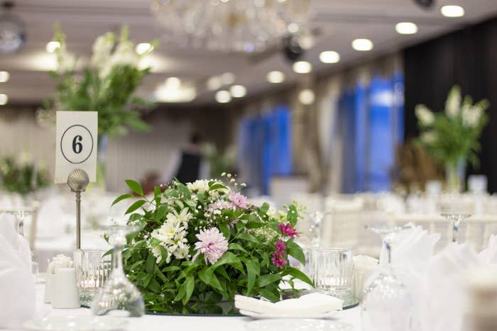 wedding table decoration with fresh colorful flowers and candles