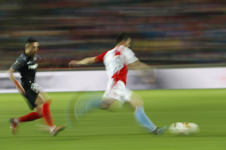 Sevilla's Munir, left, and Slavia's Ondrej Kudela vie for the ball during their Europa League Round of 16 second leg soccer match between Slavia Praha and Sevilla at the Sinobo stadium in Prague, Czech Republic, Thursday, March 14, 2019. (AP Photo/Petr David Josek)