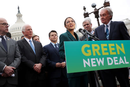 FILE PHOTO: U.S. Representative Alexandria Ocasio-Cortez (D-NY) and Senator Ed Markey (D-MA) hold a news conference for their proposed "Green New Deal" to achieve net-zero greenhouse gas emissions in 10 years, at the U.S. Capitol in Washington, U.S. February 7, 2019. REUTERS/Jonathan Ernst