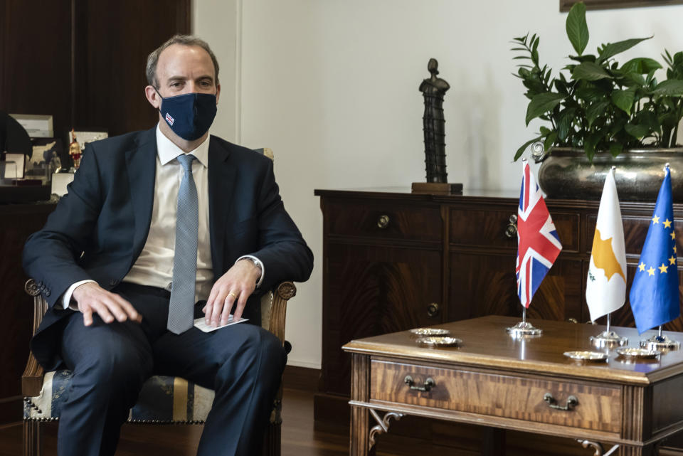 Britain's Secretary of State for Foreign Affairs, Dominic Raab, is seen during a meeting with Cypriot Foreign Minister Nicos Christodoulides at the foreign house in capital Nicosia, Cyprus, Thursday, Feb. 4, 2021. Raab is in Cyprus for one day of talks (Iakovos Hatzistavrou Pool via AP)