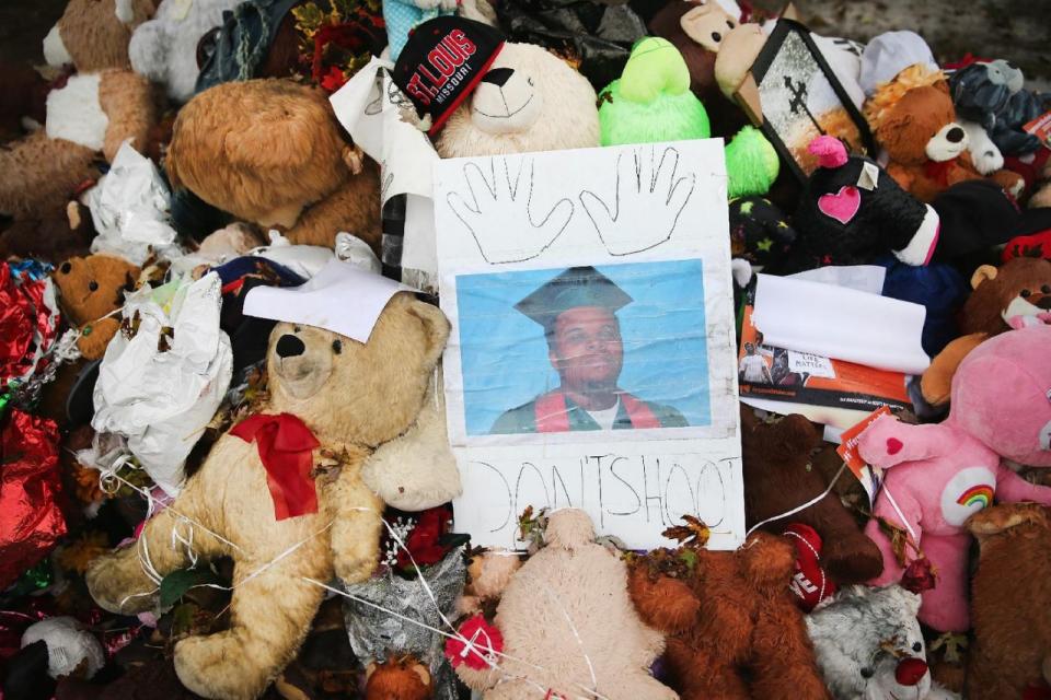 <p>A makeshift memorial sits near the spot where 18-year-old Michael Brown was shot and killed by a police officer on October 10, 2014 in Ferguson, Missouri. (Scott Olson/Getty Images) </p>