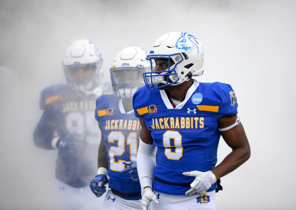 South Dakota State players enter the field to play Holy Cross in the FCS quarterfinals on Saturday, December 10, 2022, in Sioux Falls.