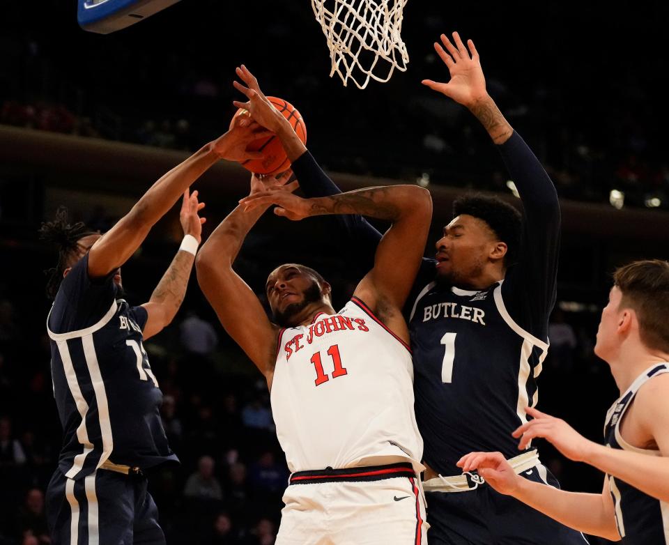 Mar 8, 2023; New York, NY, USA;  St. John's Red Storm center Joel Soriano (11) shot is defended by Butler Bulldogs guard Jayden Taylor (13) and forward Jalen Thomas (1) at Madison Square Garden.