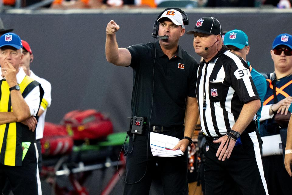Aug 12, 2022; Cincinnati, Ohio, USA;  Cincinnati Bengals head coach Zac Taylor argues a holding call with a referee in the first half of the NFL preseason game between the Cincinnati Bengals and the Arizona Cardinals at Paycor Stadium. Mandatory Credit: Albert Cesare-USA TODAY Sports