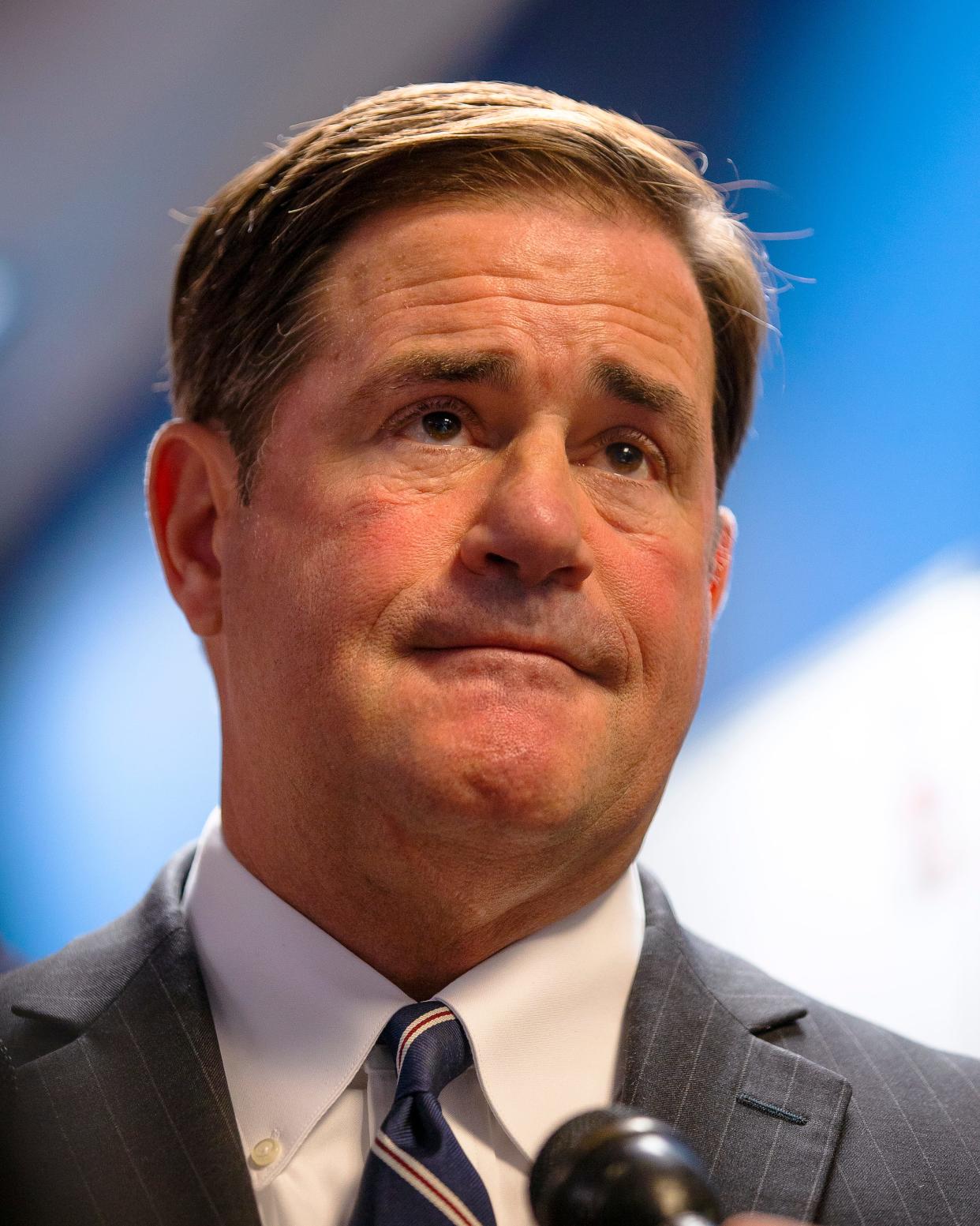 Following a ribbon-cutting ceremony, Gov. Doug Ducey answers questions from reporters at the Arizona Counter Terrorism and Information Center in Phoenix on Oct. 4, 2021.