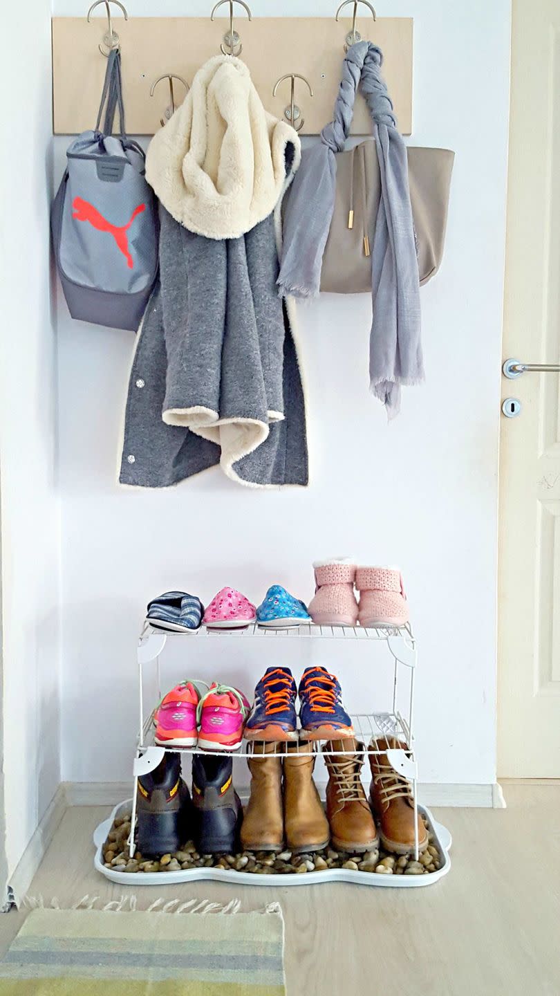 <p>Need some shoe storage that also allows them to dry? Look no further than this tutorial that brings together a multi-level shoe organizer and drying tray. </p><p><strong>Get the tutorial at <a href="https://theseamanmom.com/diy-shoe-storage/" rel="nofollow noopener" target="_blank" data-ylk="slk:Easy Peasy Creative" class="link ">Easy Peasy Creative</a>.</strong></p>