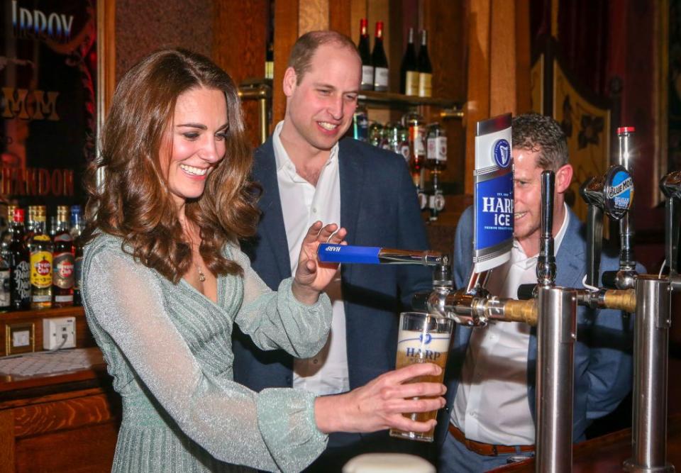 <p>Kate pulled pints of lager while Will watched dotingly at the Empire Music Hall on a visit to Belfast, Northern Ireland . </p>