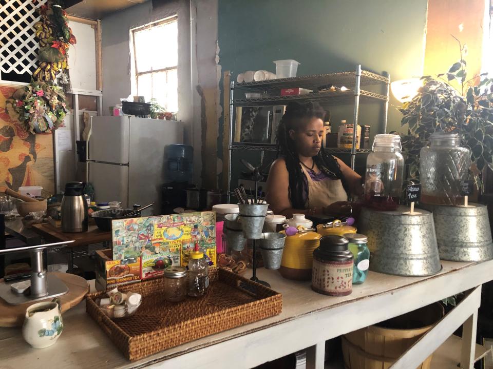 Marni Woodson prepares tea for her customers Thursday, May 17.