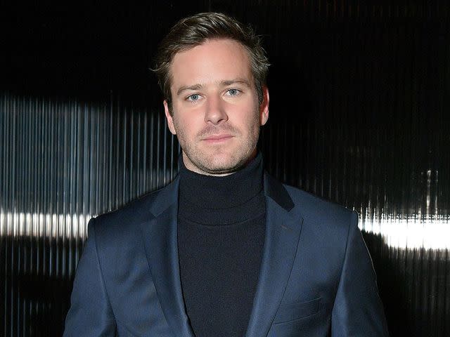 <p>Mike Coppola/Getty </p> Armie Hammer poses for a photo at BOSS Menswear - Front Row at New York Fashion Week Mens' on February 7, 2018 in New York City.