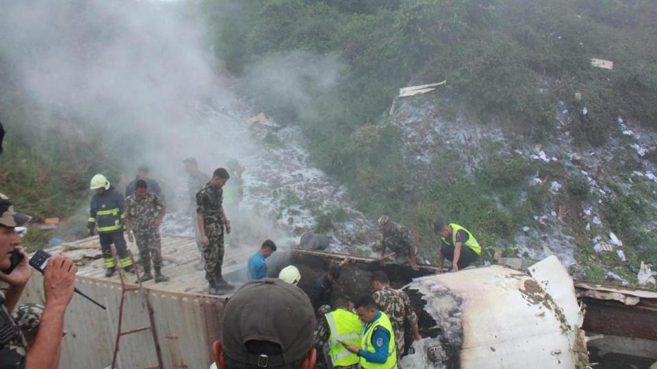 Rescuers dig through wreckage at scene of plane crash 