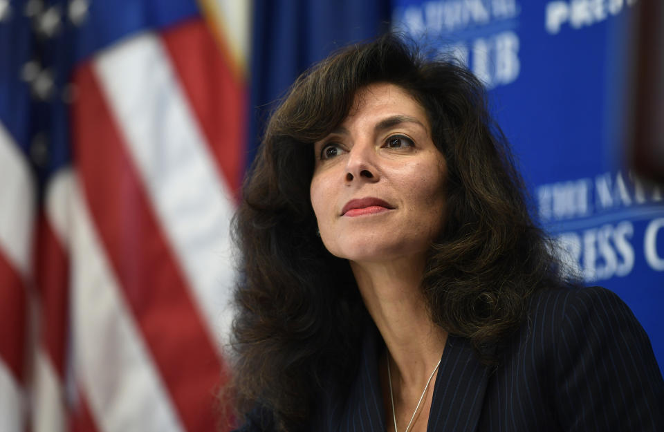 FILE - In this Sept. 21, 2018, file photo, A. Ashley Tabaddor, a federal immigration judge in Los Angeles who serves as the President of the National Association of Immigration Judges, listens as she is introduced to speak at the National Press Club​ in Washington, on the pressures on judges and the federal immigration court system. Immigration judges say they are being muzzled by the Trump administration and the union that represents them is suing the U.S. Department of Justice. The lawsuit filed Wednesday, July 1, 2020, is the latest confrontation between the judges and the Justice Department, which oversees U.S. immigration courts. (AP Photo/Susan Walsh, File)