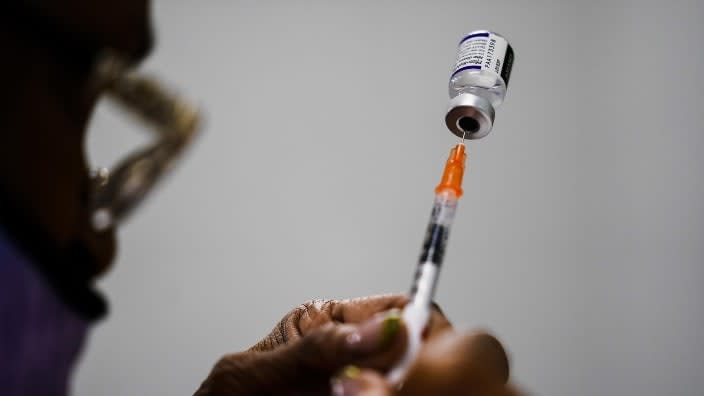 In late 2021, a syringe is prepared with the Pfizer COVID-19 vaccine at a vaccination clinic at the Keystone First Wellness Center in Chester, Pa. (Photo: Matt Rourke/AP, File)