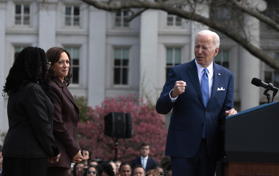 President Biden gestures to Vice President Kamala Harris and Judge Ketanji Brown Jackson.