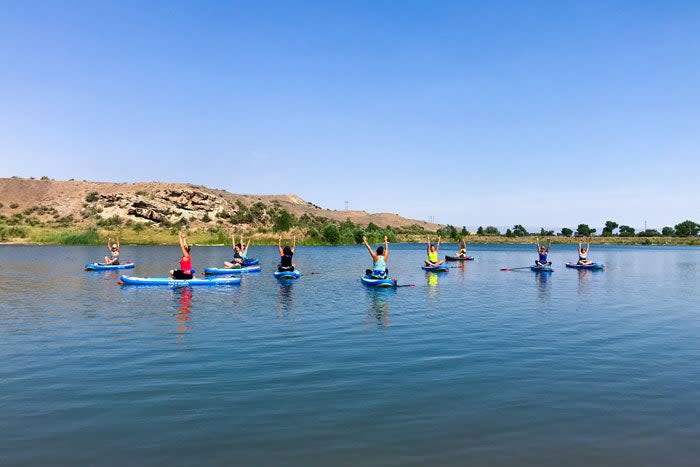 Yoga on stand-up paddleboards at Fruita's Snooks Bottom Open Space