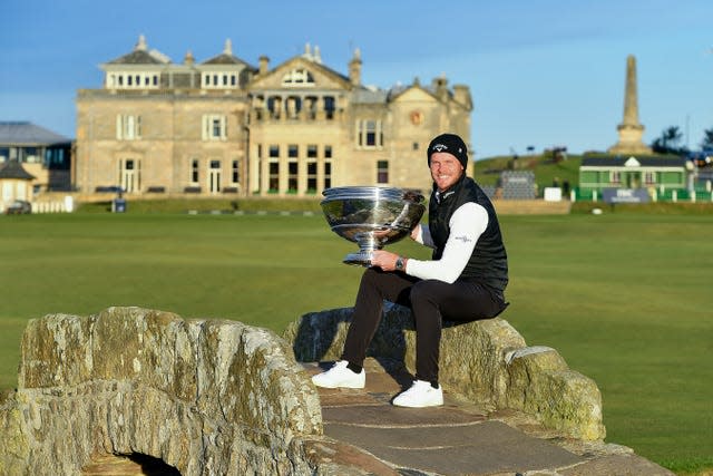 Danny Willett poses with the trophy on the Swilken Bridge