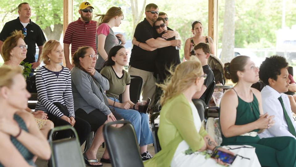 Family and friends of Jessica Hiatt listen to a speaker during her celebration of life service at Nelson Park in Slater on Monday, May 16, 2022.