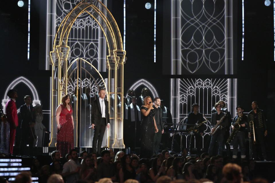 Mary Lambert, from left foreground, Macklemore and Queen Latifah perform "Same Love' on stage at the 56th annual Grammy Awards at Staples Center on Sunday, Jan. 26, 2014, in Los Angeles. (Photo by Matt Sayles/Invision/AP)