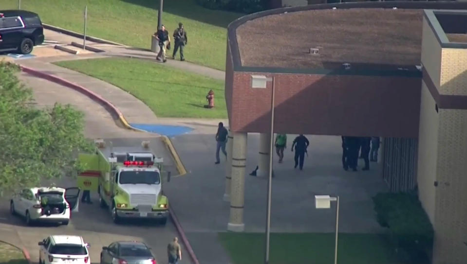 <p>In this image taken from video law enforcement officers respond to a high school near Houston after an active shooter was reported on campus, Friday, May 18, 2018, in Santa Fe, Texas. The Santa Fe school district issued an alert Friday morning saying Santa Fe High School has been placed on lockdown. (Photo: KTRK-TV ABC13 via AP) </p>