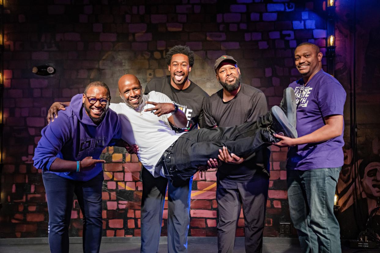 Founding members of Black Iowa Streams, Day Peace, Bernard Bell, Clifton Antoine, Dante Powell, and Perry Thompson pose for a photo at Teehee's Comedy Club in Des Moines.